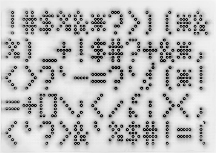 print of symbols written with dots