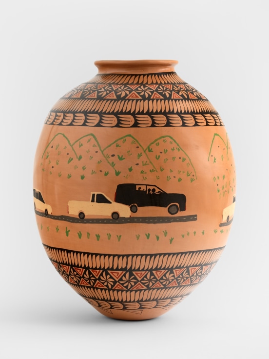 Tan ceramic pot with painted motifs and trucks by Teresa Margolles
