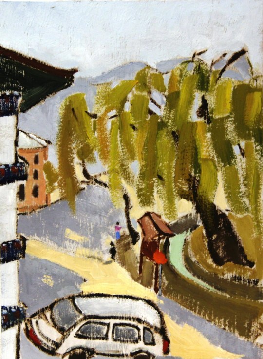 willow tree towering over a street in Bhutan