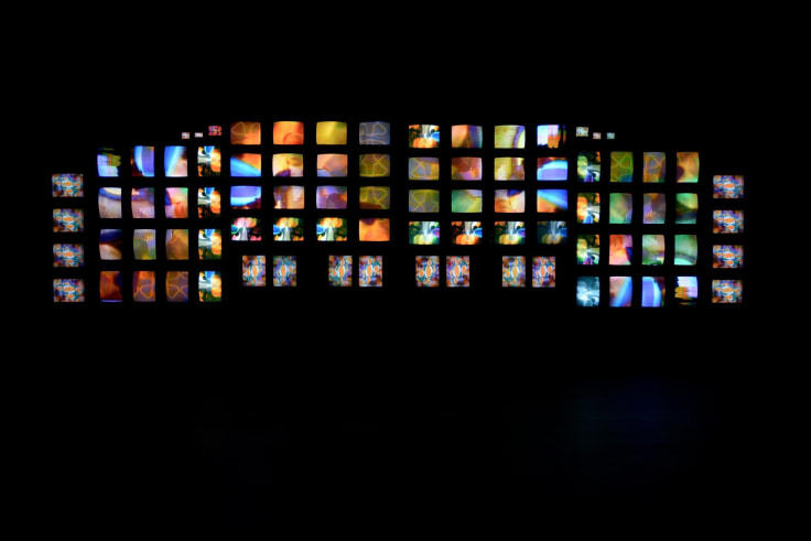 installation view of multiple TV screens