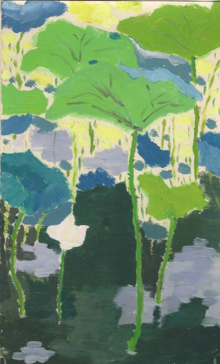 lotus plants emerging from a pool