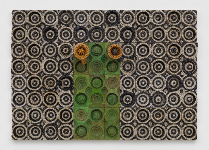 two megaphones emerging from a panel covered in electrical components