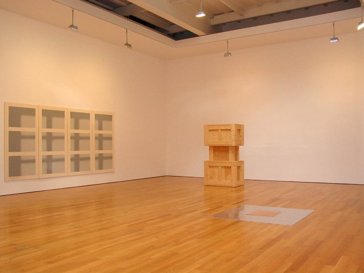 installation view of varying, square artworks
