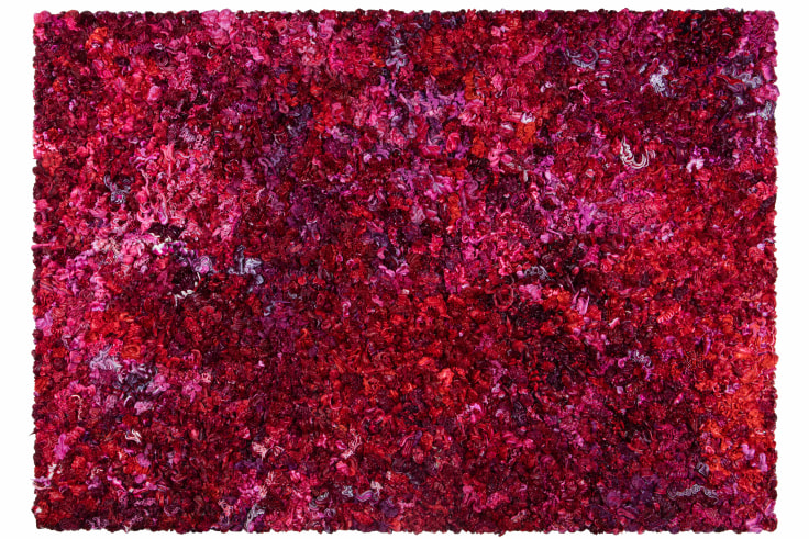 A series of dark red and purple whipped-cream-like dollops made of oil on a rectangular canvas