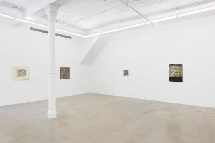 Installation view of four artworks