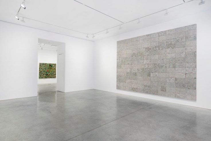 view of a large artwork next to an entry way leading to another room