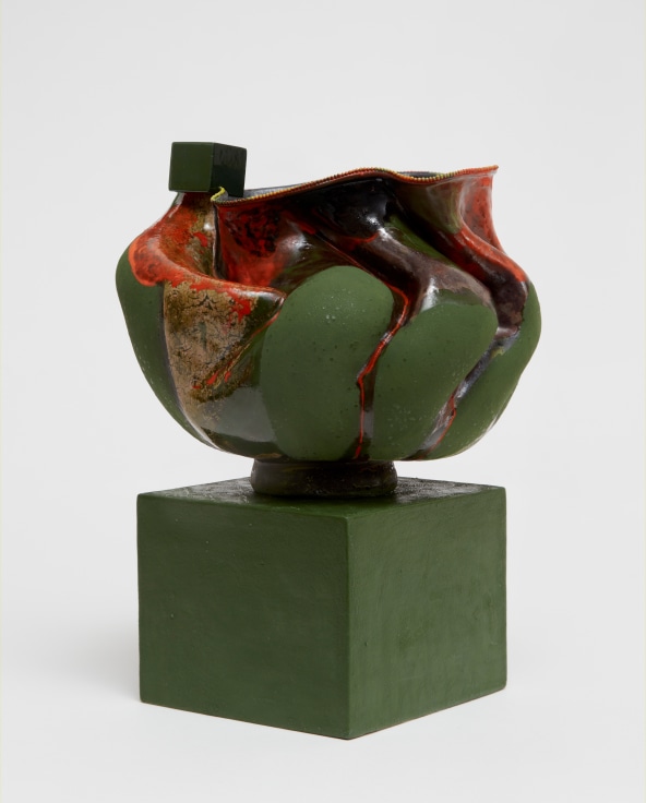 Ridged and grooved porcelain pot with a cube perched on its opening by Kathy Butterly.