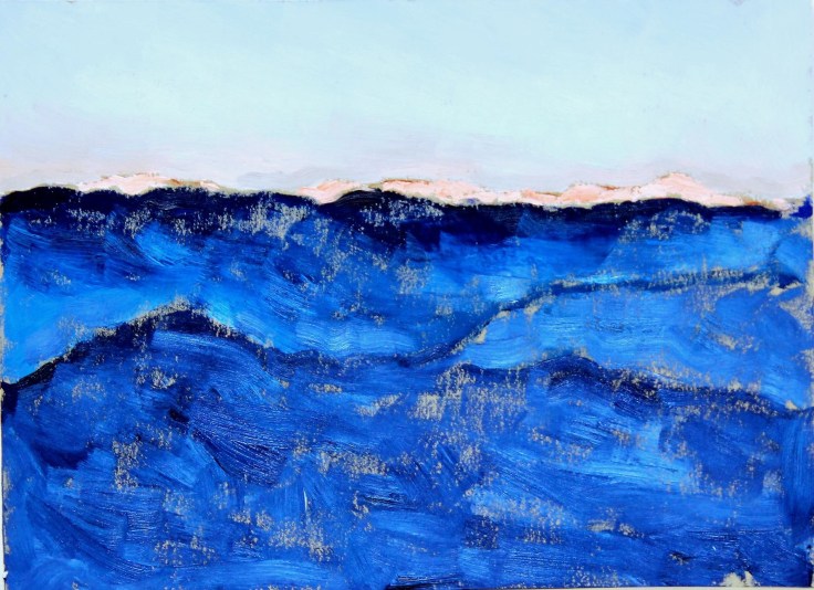 landscape of a mountain range colored a vibrant blue signifying that it's still dark but growing lighter as the sun rises