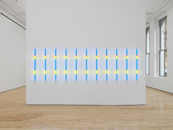 Series of colorful LED lights installed on a white wall