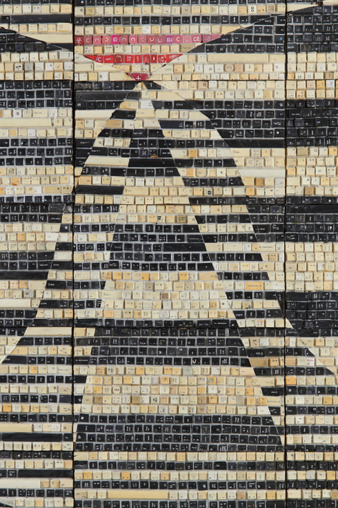 close up of black and white keyboard keys creating a pattern