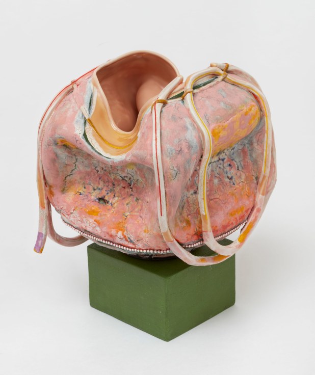 Predominantly orange, pink, collapsed bag-like form by Kathy Butterly.