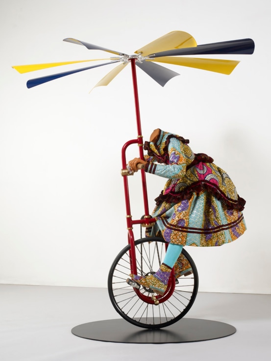 , YINKA SHONIBARE MBE, Girl on Flying Machine, 2008, mannequin, Dutch wax printed cotton, steel, rubber and aluminum, 65 x 22 x 31.5 in., 165 x 56 x 80 cm