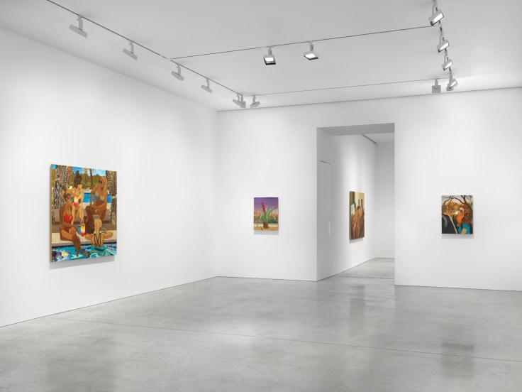 gallery view of sever artworks and an entryway leading to another room with more art