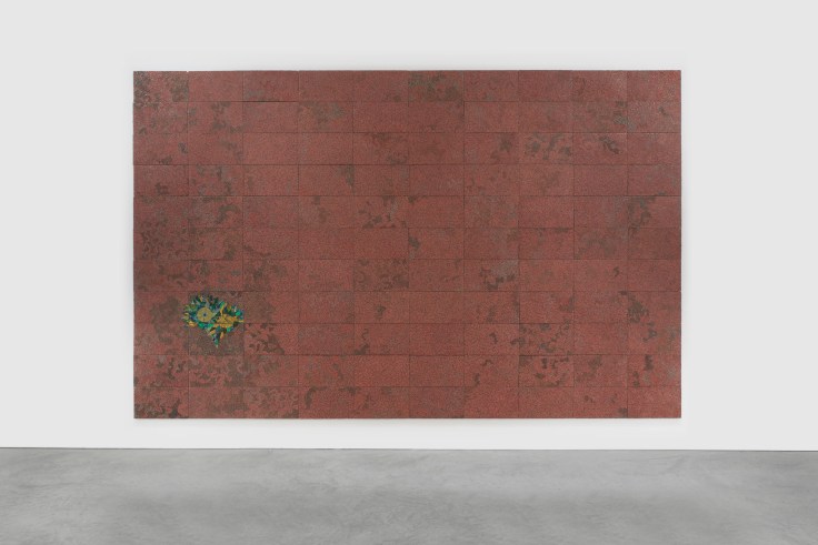 a mostly red panel with a green section on the lower left composed of electrical components