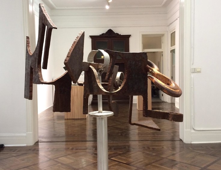 installation view of one metal sculpture