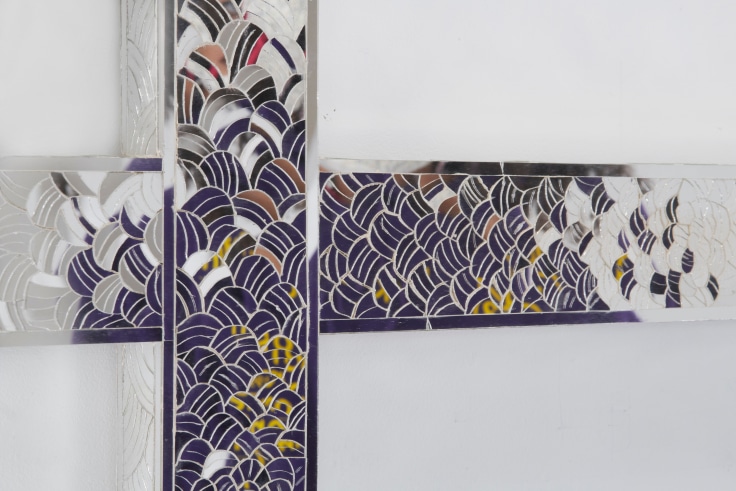 glass pieces creating a scale-like pattern