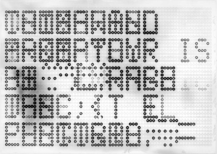 print of superimposed letters writing out different sentences