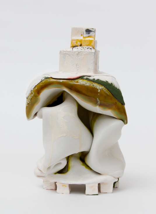 Lamoinous clay sculpture with a cubic piece perched on top by Kathy Butterly.