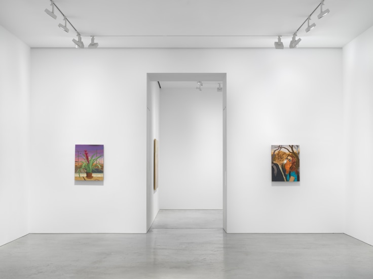 an entryway flanked by two artworks