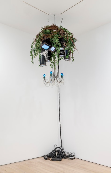 chandelier made up of TV screens and fake plants
