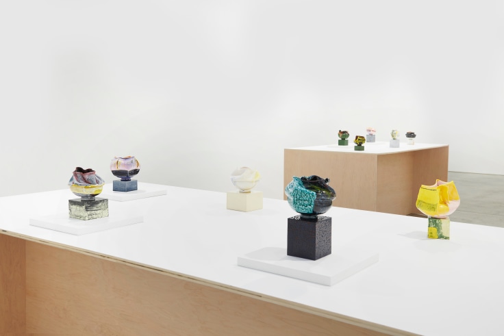 close up of small artworks on on of the tables