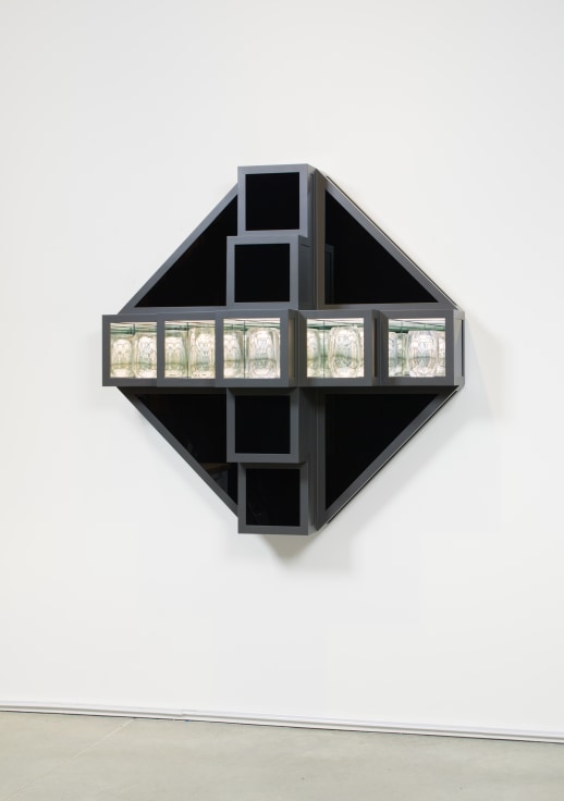 Five in-laid lit box installed horizontally on top of a black canvas with grey wood frame