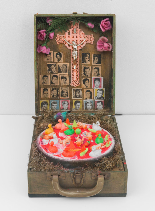 box with a cross and a plate with rubber duckies and babies