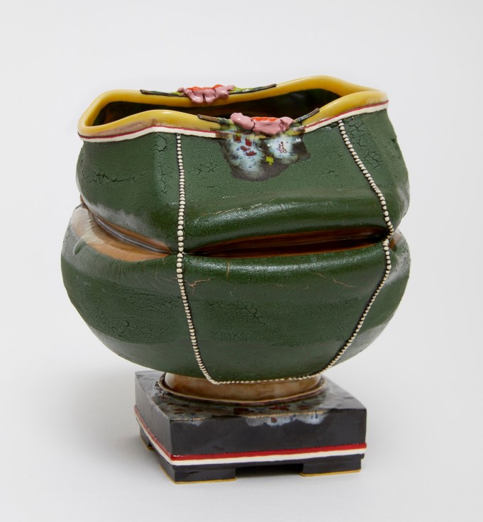 Caved-in, dark green clay pot by Kathy Butterly.
