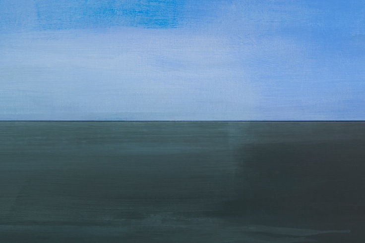 An abstract depiction of half light blue sky and half bluish grey ocean