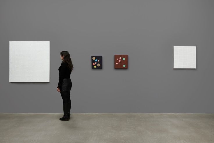 person observing a white artwork