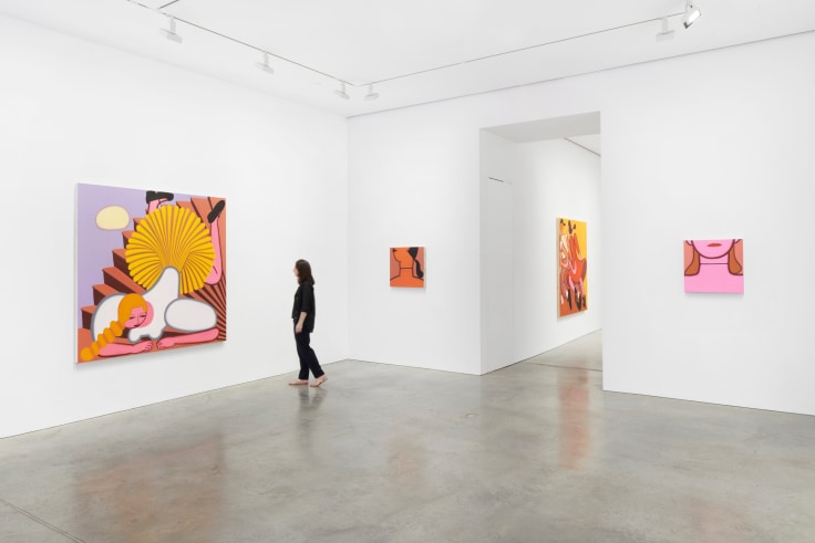 a figure walking towards a painting