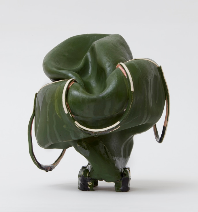 Caved-in dark green clay sculpture with draping handles by Kathy Butterly.