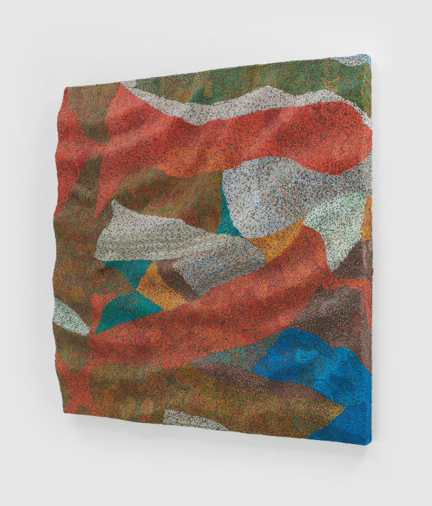 woven electrical wires that create a colorful pattern on a panel