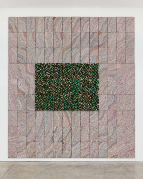 reclaimed electrical wires and components creating a green rectangle in the middle of light, neutral colors