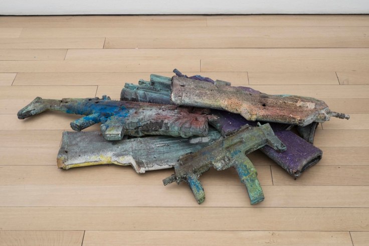 guns covered in varying colors