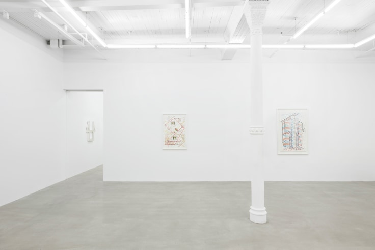 gallery view of two artworks with a doorway to the left leading to another room