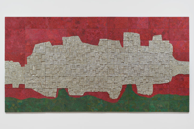 red, green, and off-white shape composed of electrical components on panel