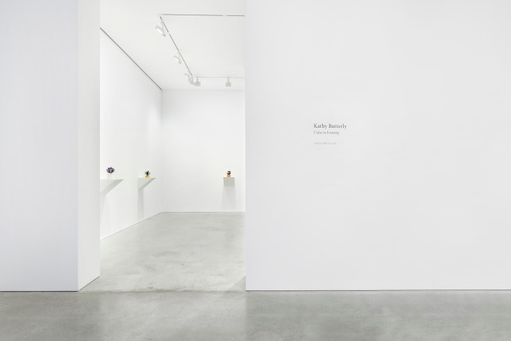 exhibition entrance revealing three artworks