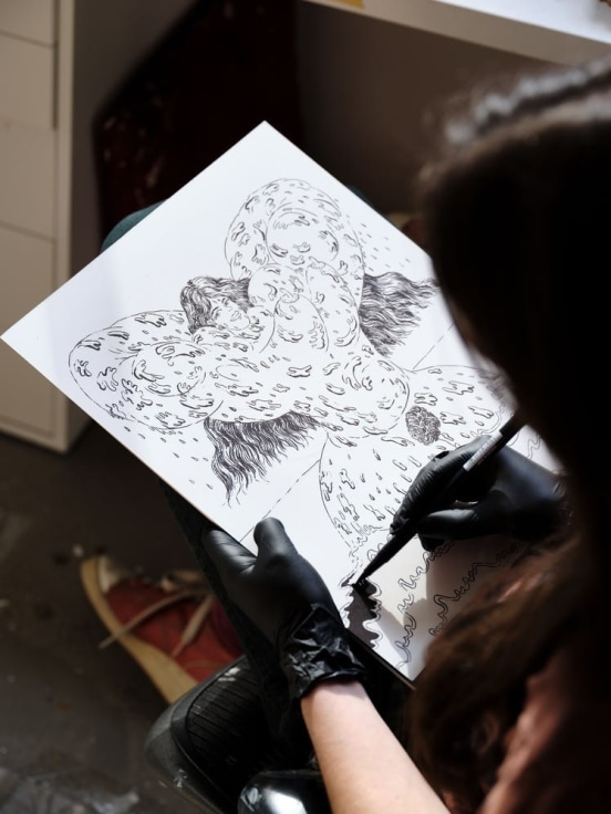 The artist Ana Benaroya working on an illustration
