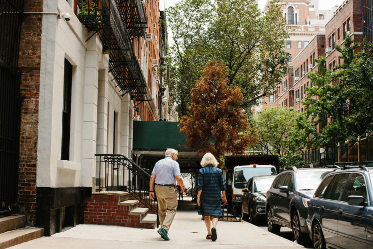 Portrait of Peter and Sally Saul walking on the Upper East Side by Stephanie Nortiz for Artsy.