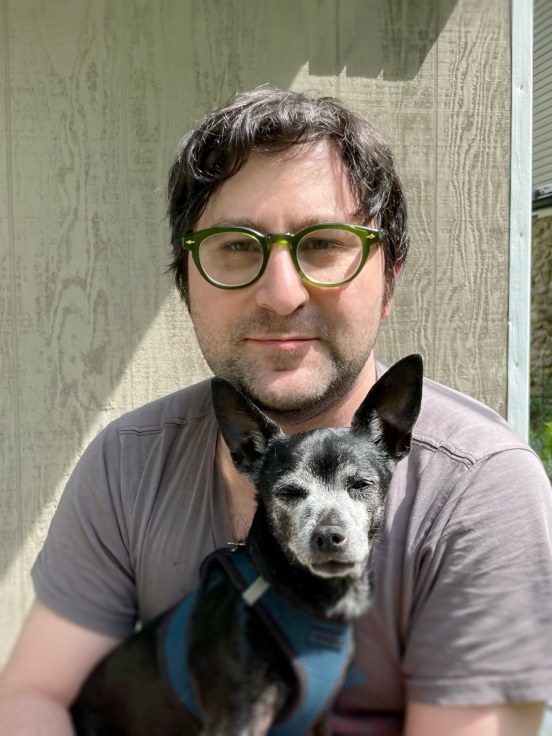Portrait of artist Seth Becker and his dog Toby