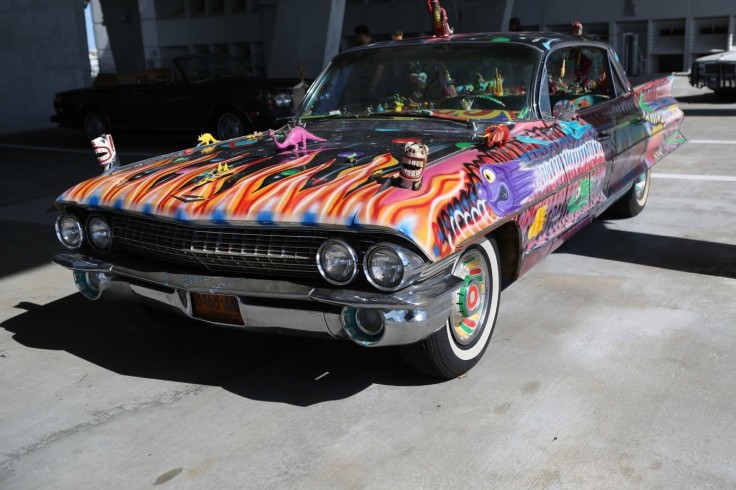 KENNY SCHARF, &quot;SUPREMA ULTIMA DELUXA VAN CHROME CADILLAC,&quot; 1984. CADILLAC CAR FROM 1961 WITH MIXED MEDIA, ACRYLIC, SPRAY-PAINT, FOUND OBJECTS.