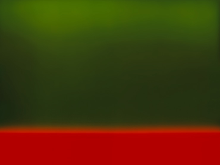 A color field which is mostly green with the bottom being red