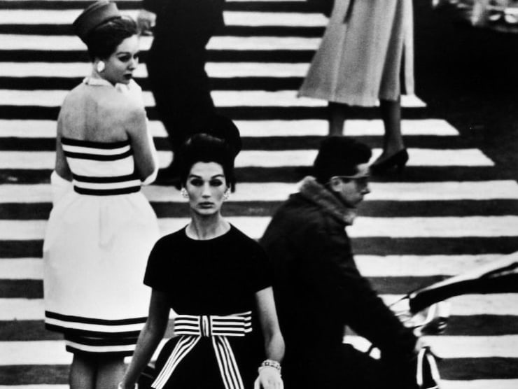Fashion models in a crosswalk photographed in black and white