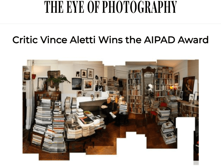 Vince Aletti sits in his apartment amongst stacks of magazines and books in his home for this Eye of Photography featured article.