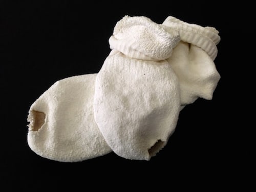 Beth Campbell, Holed pair of socks, 2014, porcelain, 8 x 5 x 2 inches
