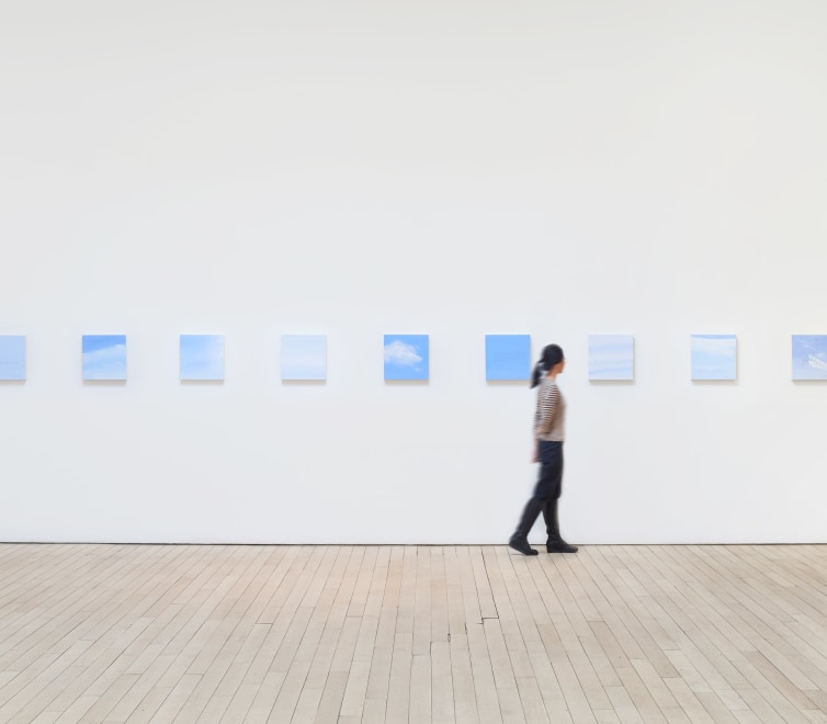 Installation image of a series of square canvases of Bryon Kim's work