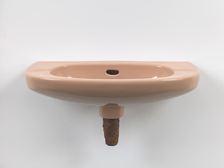 Plug, 2018. Ceramic sink, hand-rolled cigar,