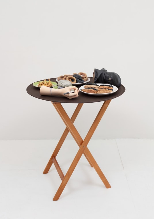 Josh Kline, 10% Tip (Applebee&#039;s Waitress&#039; Hand and Foot), 2018. 3D-printed sculptures in plaster with inkjet ink and cyanoacrylate, custom tray, wooden stand, 36 x 28 1/2 x 28 1/2 inches (91.4 x 72.4 x 72.4 cm).