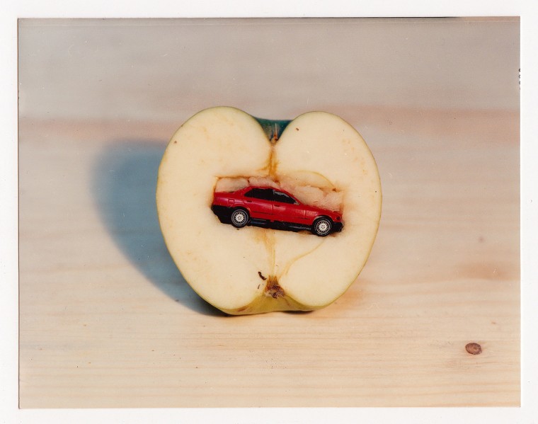 Olaf Breuning photograph of a toy car inside an apple